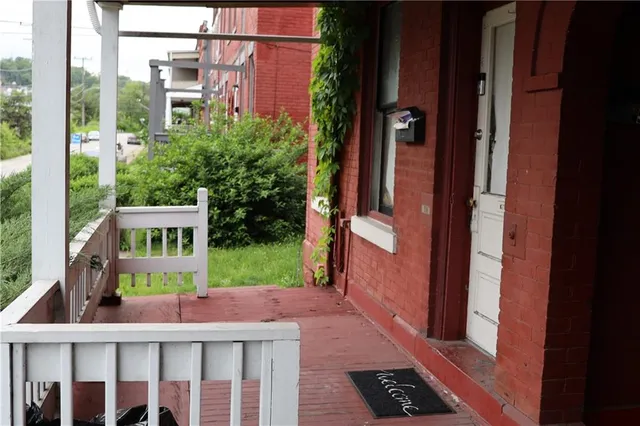 a kitchen with a sink a stove and cabinets
