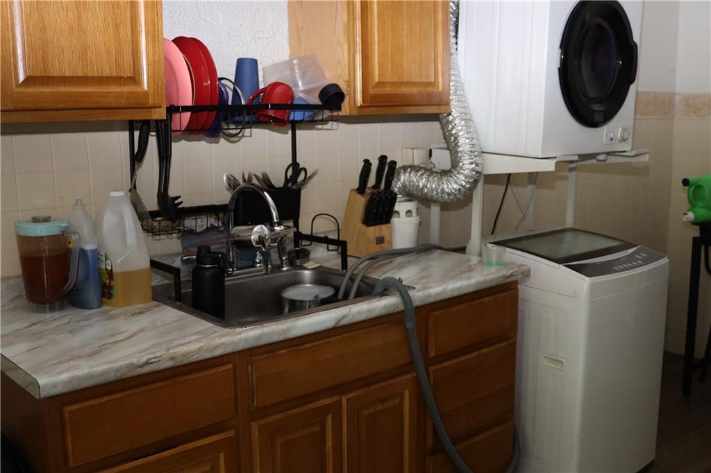 518 Middle Avenue Wilmerding, PA 15148 - Photo 20 of 37 a kitchen with a sink a stove and cabinets