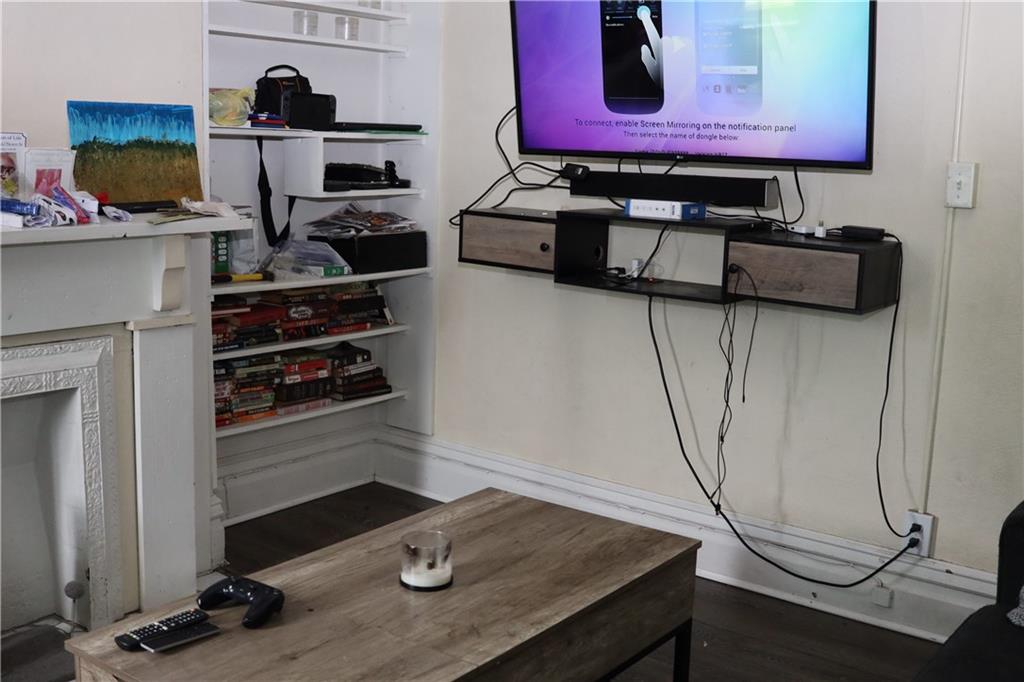 518 Middle Avenue Wilmerding, PA 15148 - Photo 23 of 37 a room with a wooden floor and cabinets