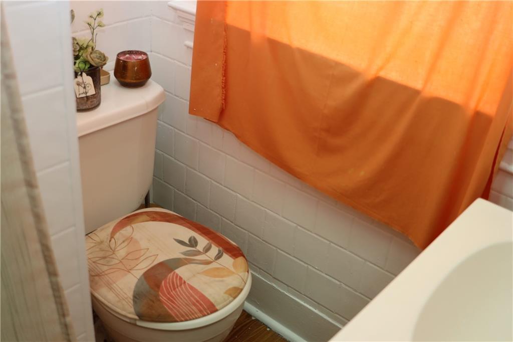 518 Middle Avenue Wilmerding, PA 15148 - Photo 28 of 37 a bathroom with a sink and a mirror