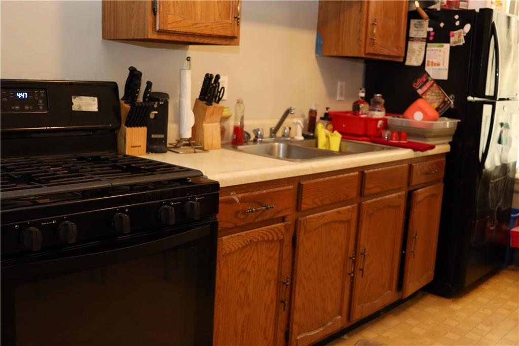518 Middle Avenue Wilmerding, PA 15148 - Photo 30 of 37 a kitchen with stainless steel appliances granite countertop a stove and a sink