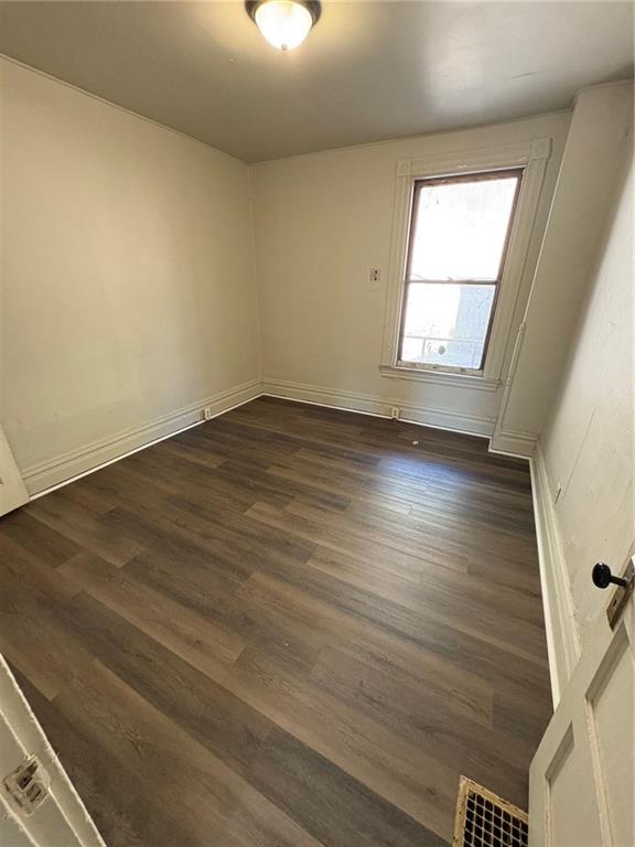 518 Middle Avenue Wilmerding, PA 15148 - Photo 31 of 37 an empty room with wooden floor and windows