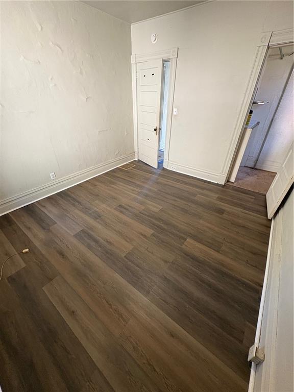 518 Middle Avenue Wilmerding, PA 15148 - Photo 33 of 37 a view of an empty room with wooden floor and a window