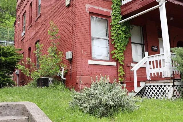 front view of a house with a garden