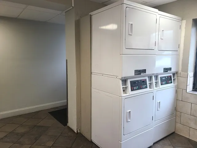 a view of storage and utility room with washer and dryer