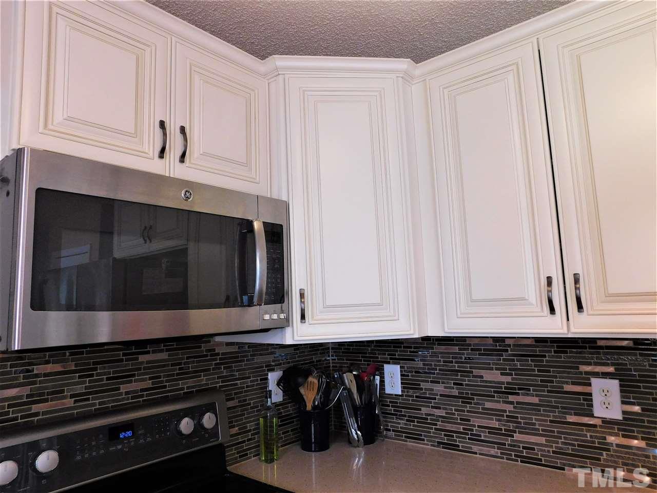 9420 Dawnshire Road Raleigh, NC 27615 - Photo 29 of 30 View of New Cabinets and Tile Work! Stainless Appliances!
