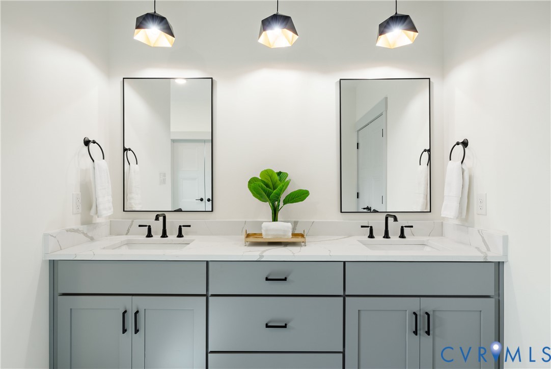 8919 Rustic Road Richmond, VA 23235 - Photo 24 of 36 Dual vanity with shaker cabinetry, white counterto