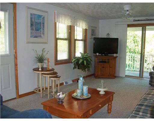 135 Fox Hollow Road Kittanning, PA 16201 - Photo 14 of 17 Living Room. Living room with beveled sliders to the huge outdoors