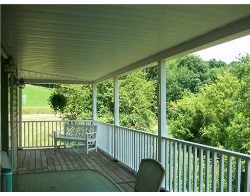 135 Fox Hollow Road Kittanning, PA 16201 - Photo 8 of 17 Patio/Deck. Just relax time on this wrap-around porch