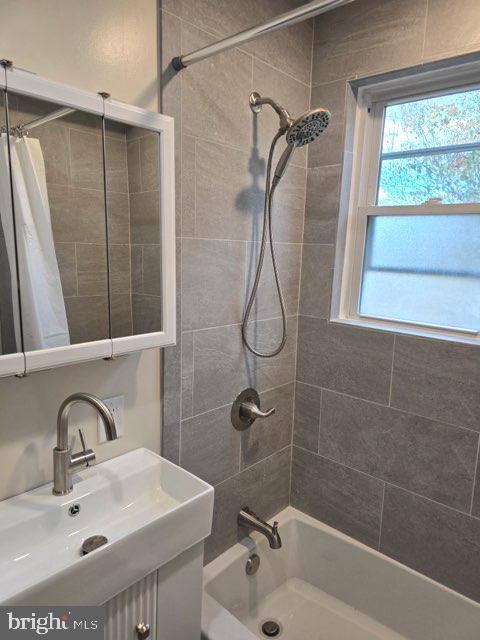 362 Ripka Street, Unit A Philadelphia, PA 19128 - Photo 10 of 18 a bathroom with a sink mirror and shower