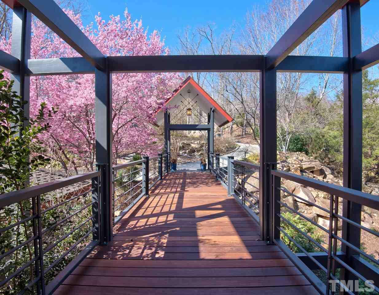 55219 Broughton Chapel Hill, NC 27517 - Photo 2 of 25 a view of a porch with wooden floor and city view