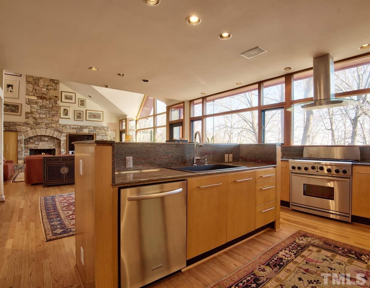 55219 Broughton Chapel Hill, NC 27517 - Photo 13 of 25 a kitchen with stainless steel appliances granite countertop a stove and a refrigerator