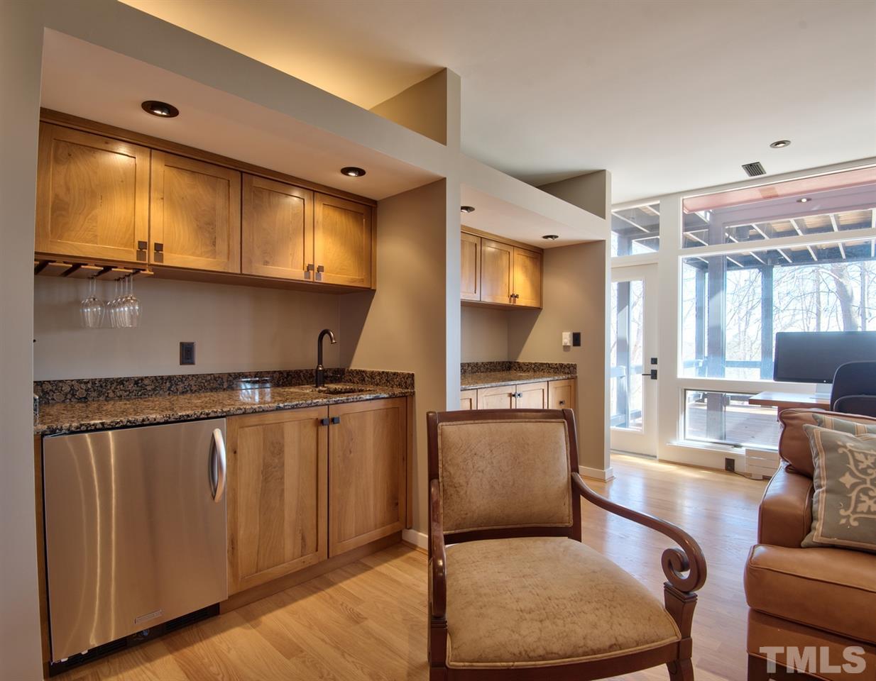 55219 Broughton Chapel Hill, NC 27517 - Photo 19 of 25 a kitchen with stainless steel appliances granite countertop a stove a sink dishwasher and a refrigerator
