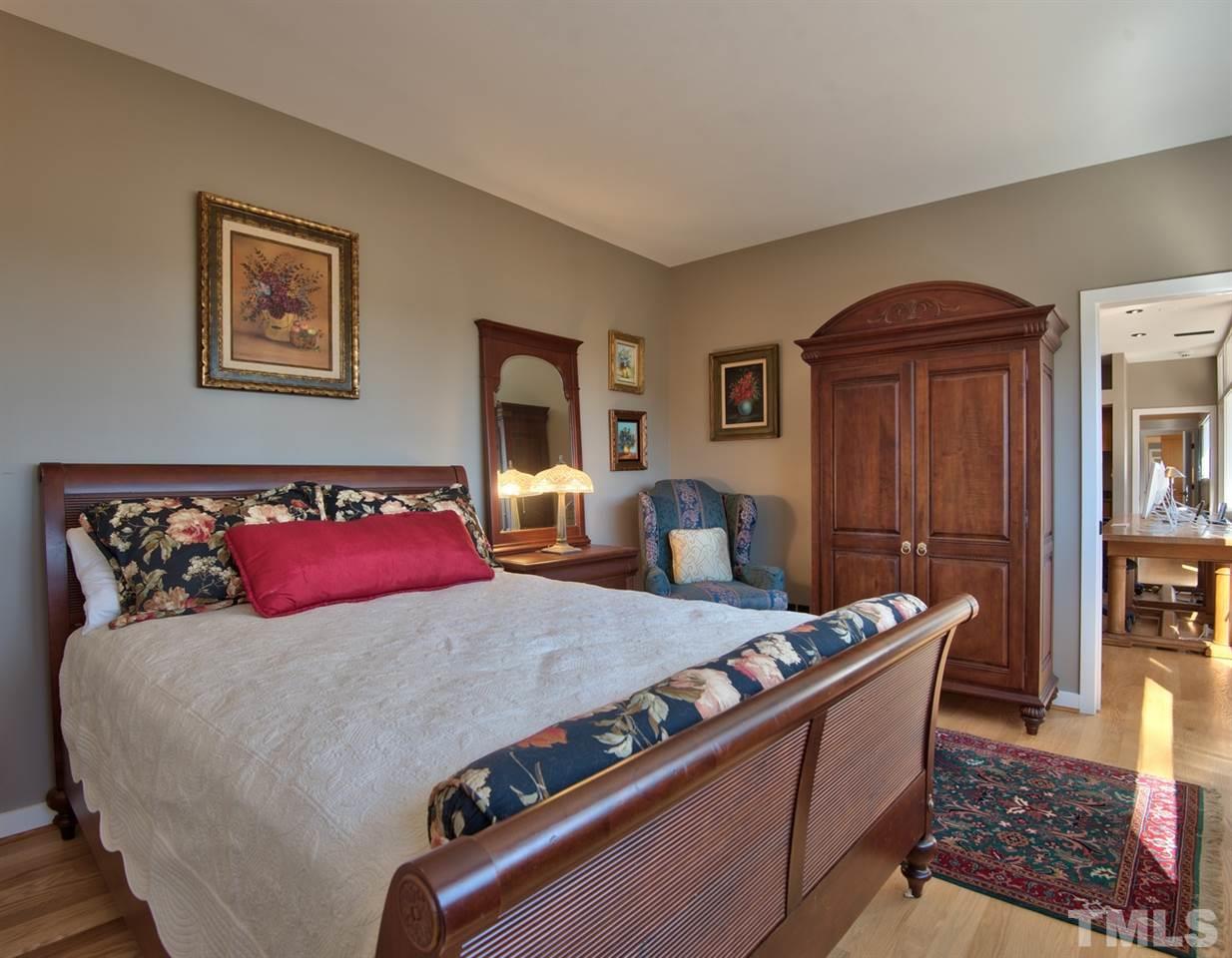 55219 Broughton Chapel Hill, NC 27517 - Photo 21 of 25 a bed sitting in a bedroom next to a window with dresser