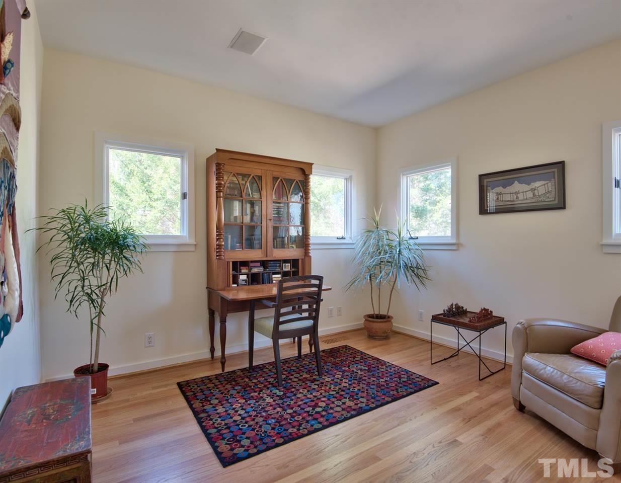 55219 Broughton Chapel Hill, NC 27517 - Photo 22 of 25 a living room with furniture rug and a window