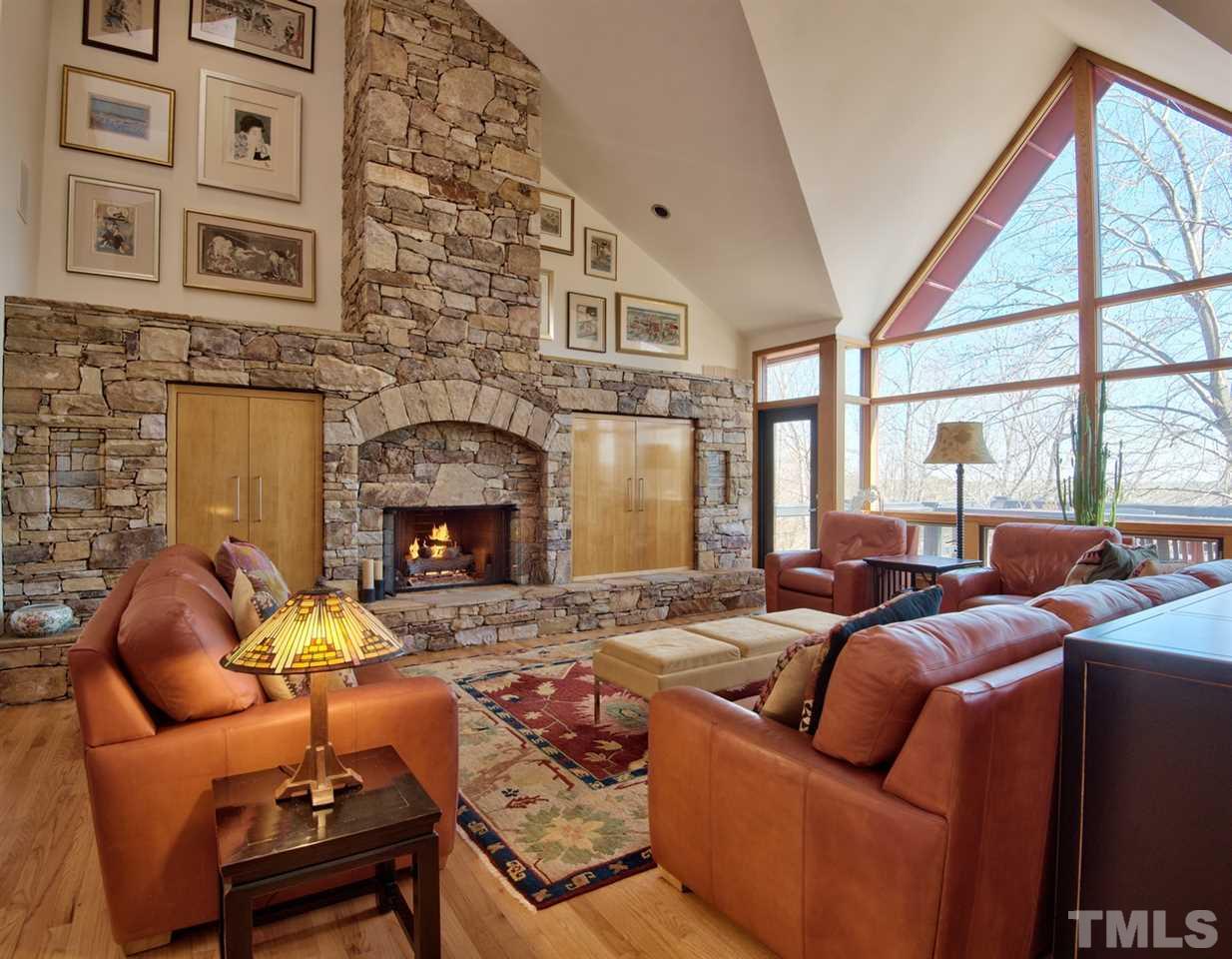 55219 Broughton Chapel Hill, NC 27517 - Photo 8 of 25 a living room with furniture a fireplace and a large window