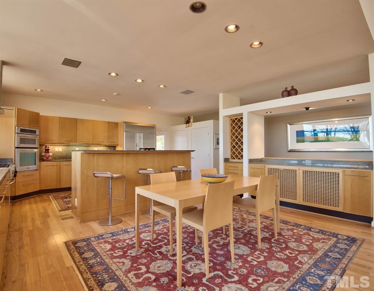 55219 Broughton Chapel Hill, NC 27517 - Photo 10 of 25 a living room with dining room and wooden floor