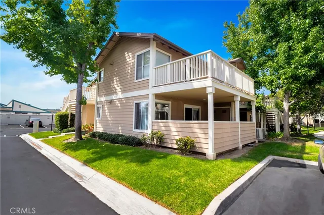 a front view of a house with a yard table and chairs