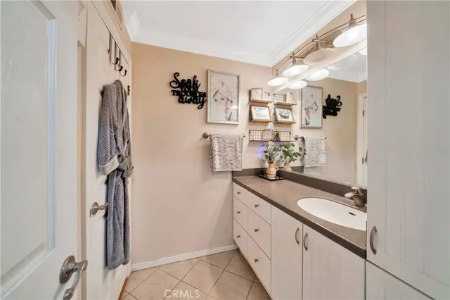 a bathroom with a double vanity sink mirror and shower