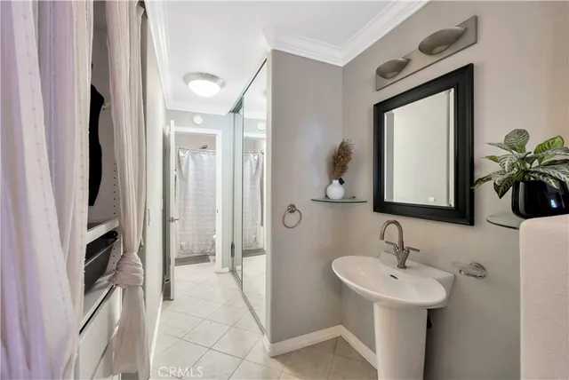 a bathroom with a sink a mirror and a shower