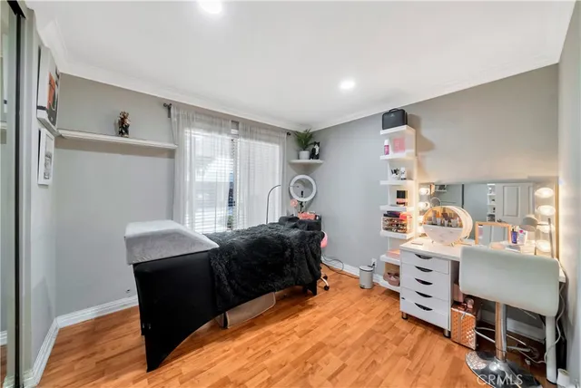 a bedroom with furniture and a window