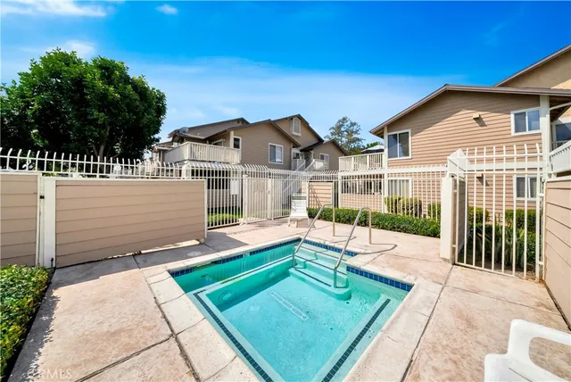 a view of a house with backyard porch and sitting area