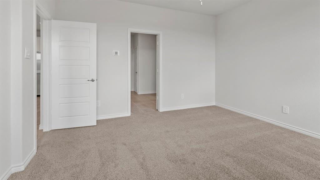 510 Range Road Caddo Mills, TX 75135 - Photo 24 of 25 Unfurnished bedroom featuring light colored carpet and baseboards