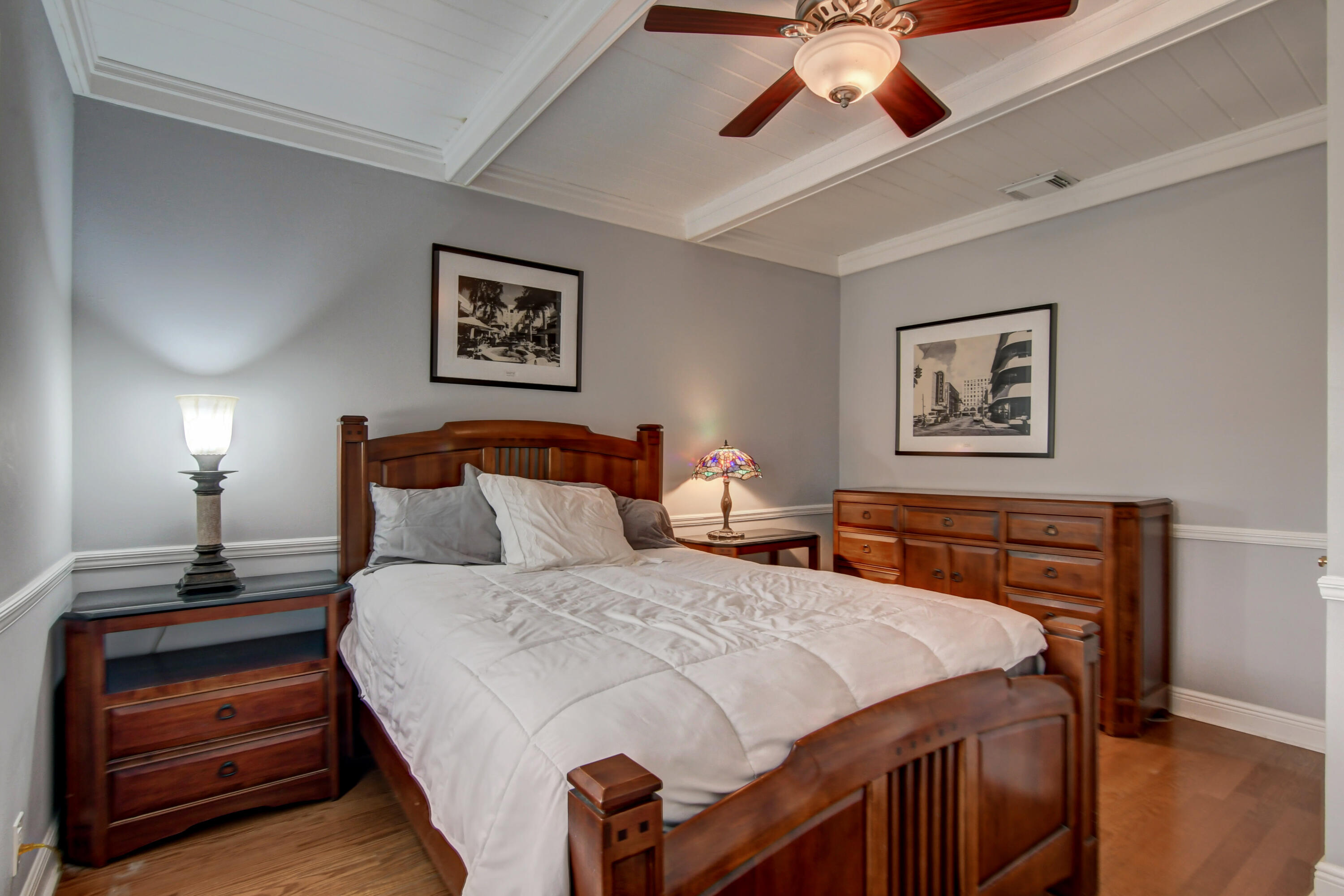 921 Southwest 20th Street Boca Raton, FL 33486 - Photo 38 of 56 a bedroom with a bed and a chandelier