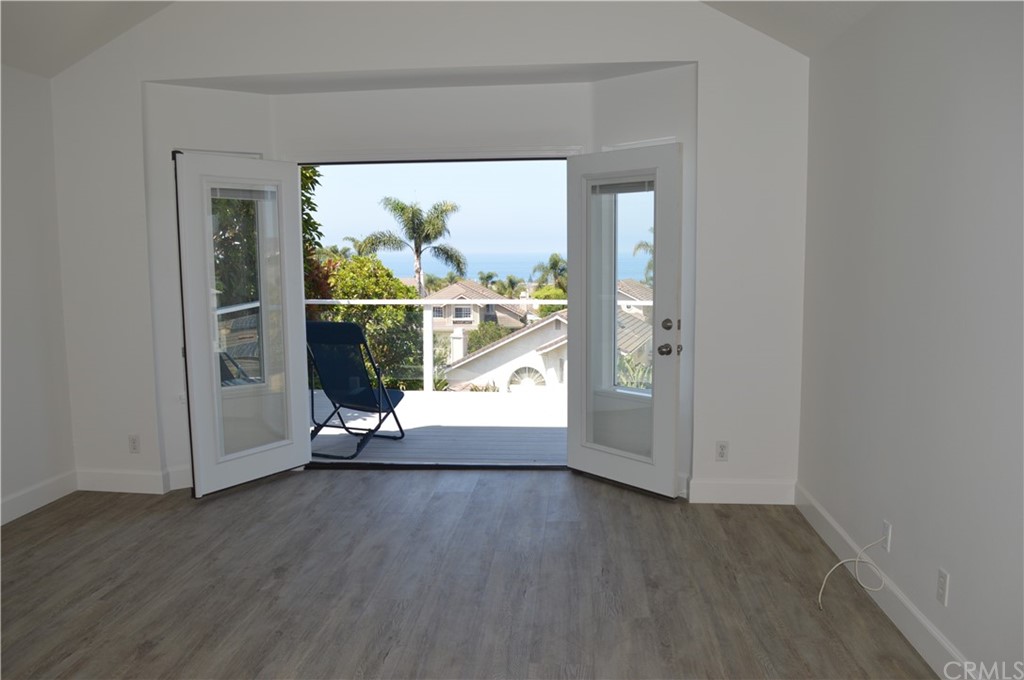 2139 Via Aguila San Clemente, CA 92673 - Photo 23 of 34 an empty room with wooden floor and entrance