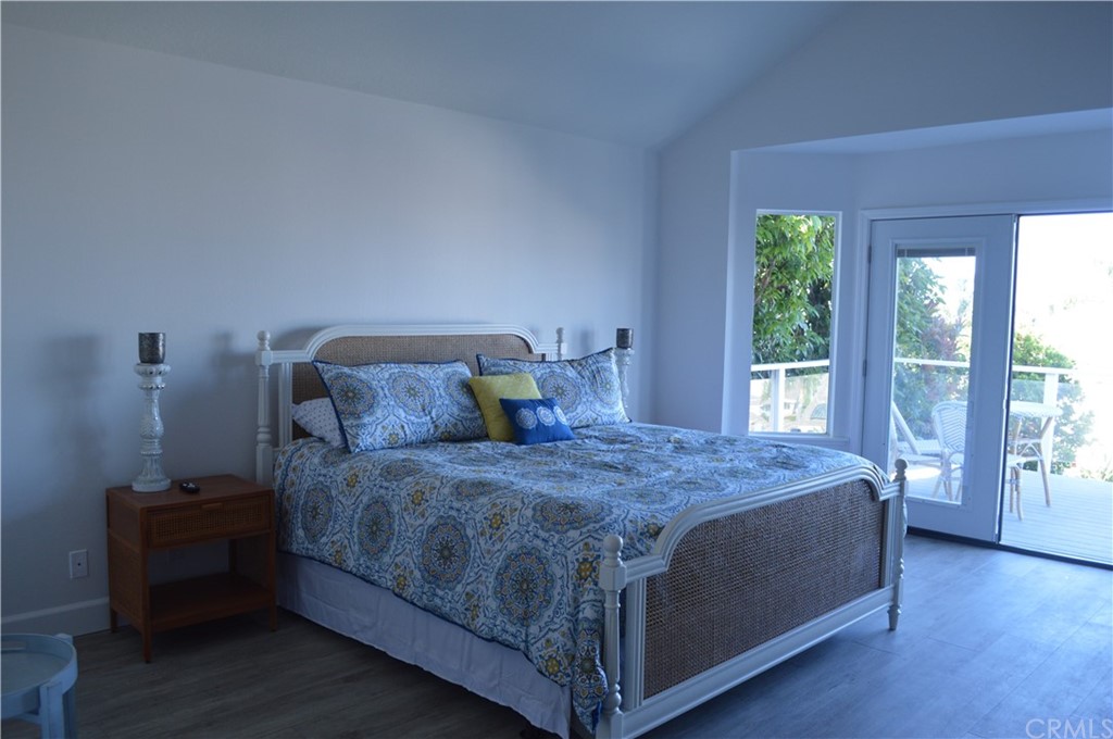 2139 Via Aguila San Clemente, CA 92673 - Photo 24 of 34 a bed sitting in a bedroom next to a window