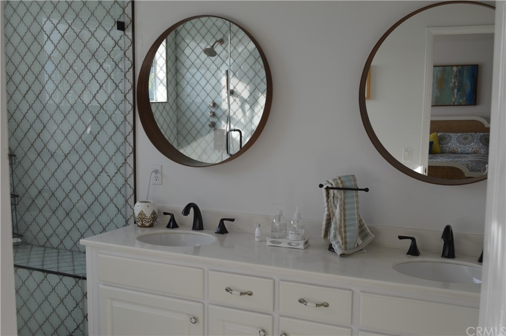 2139 Via Aguila San Clemente, CA 92673 - Photo 27 of 34 a bathroom with a sink and a mirror