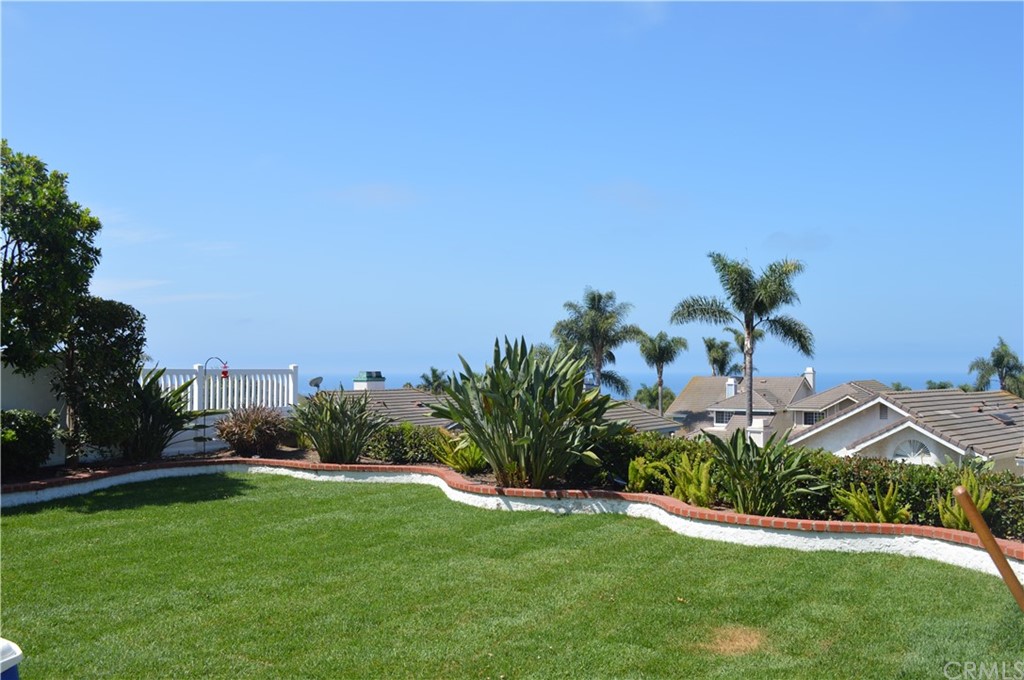 2139 Via Aguila San Clemente, CA 92673 - Photo 33 of 34 a view of a garden with a building in the background