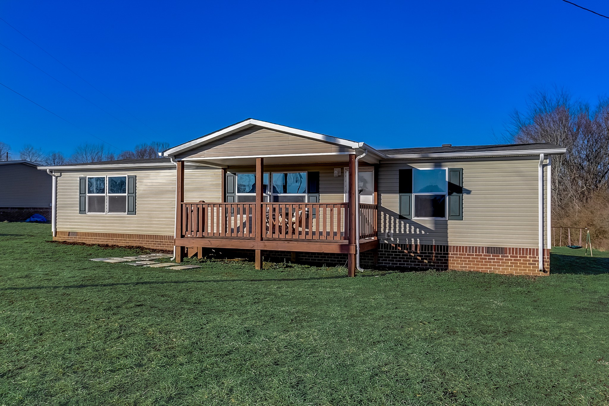 4249 Red Boiling Springs Road Lafayette, TN 37083 - Photo 1 of 16 a front view of a house with a yard