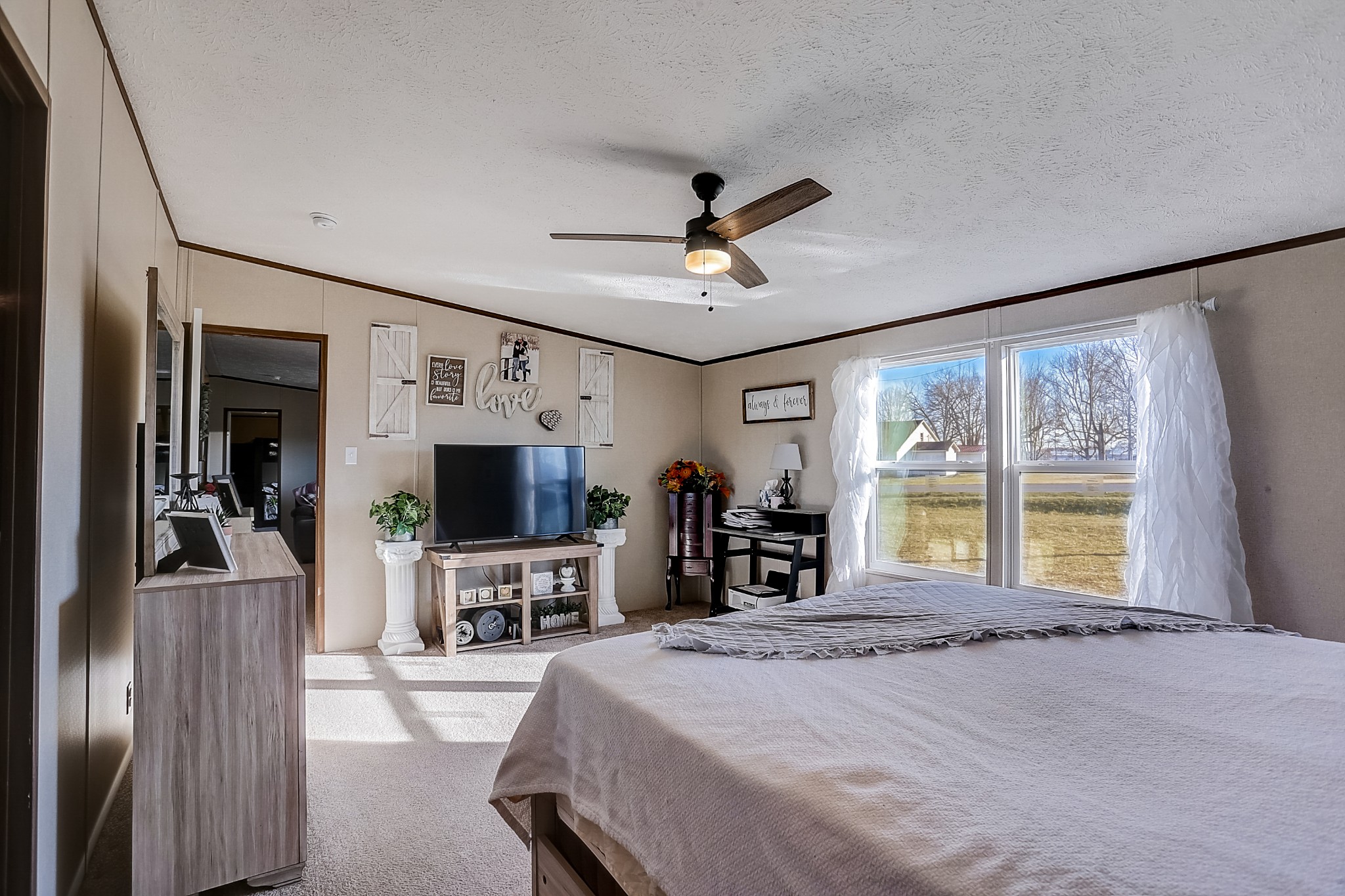 4249 Red Boiling Springs Road Lafayette, TN 37083 - Photo 8 of 16 a bed room with furniture and a flat screen tv