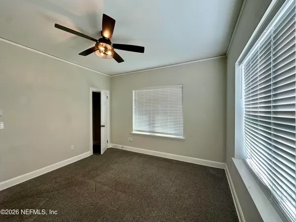 a view of an empty room with a window