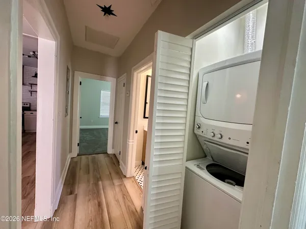 a bathroom with a sink mirror toilet shower and bathtub