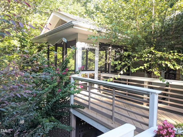 a view of a two chairs and table in a balcony