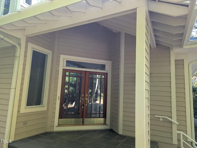 a view of a door and a window