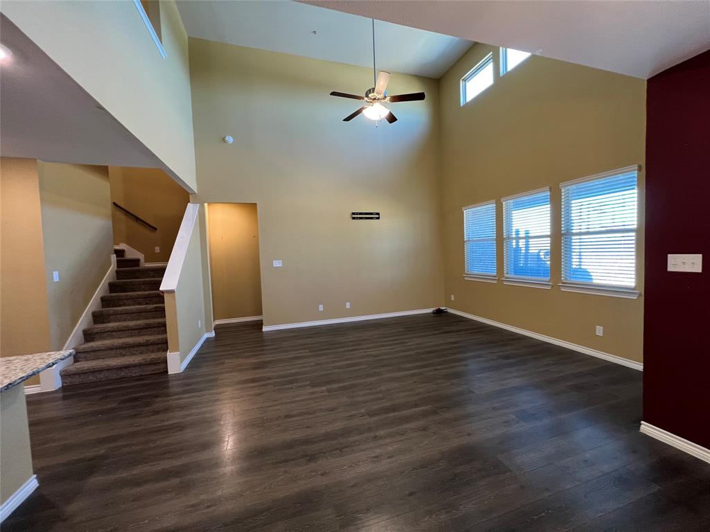 412 Gunsmoke Trail Princeton, TX 75407 - Photo 11 of 28 a view of an empty room with wooden floor and a window