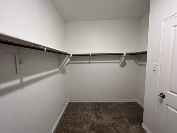 a view of a room with shelf on the wall
