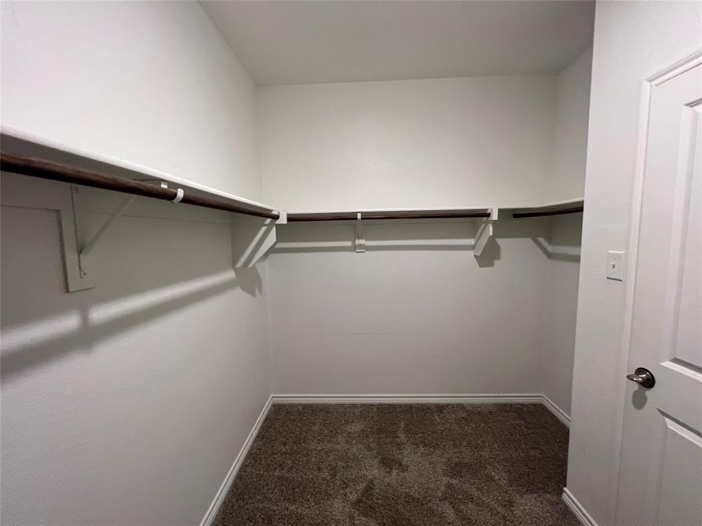 412 Gunsmoke Trail Princeton, TX 75407 - Photo 17 of 28 a view of a room with shelf on the wall
