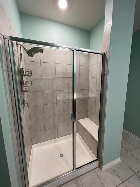 412 Gunsmoke Trail Princeton, TX 75407 - Photo 18 of 28 a bathroom with a bathtub and a shower