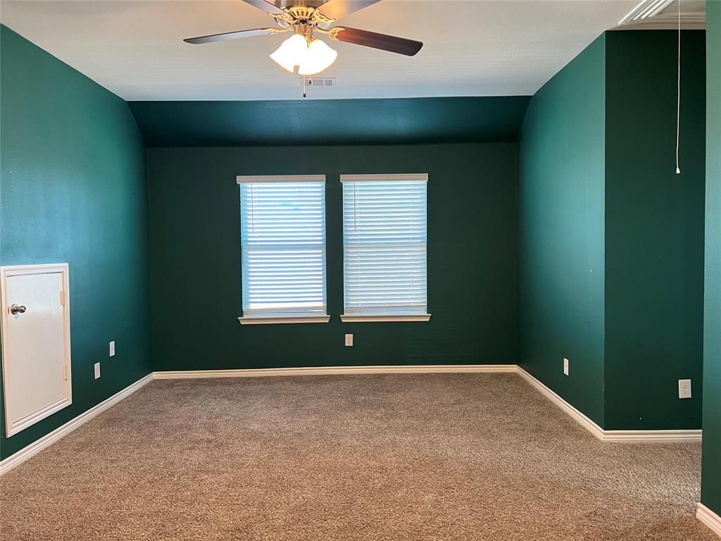 412 Gunsmoke Trail Princeton, TX 75407 - Photo 21 of 28 an empty room with a window and a fan