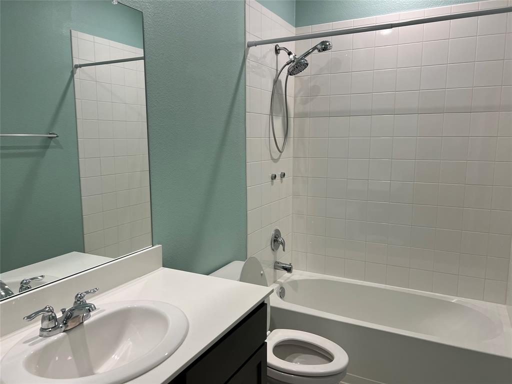412 Gunsmoke Trail Princeton, TX 75407 - Photo 27 of 28 a bathroom with a sink toilet and shower