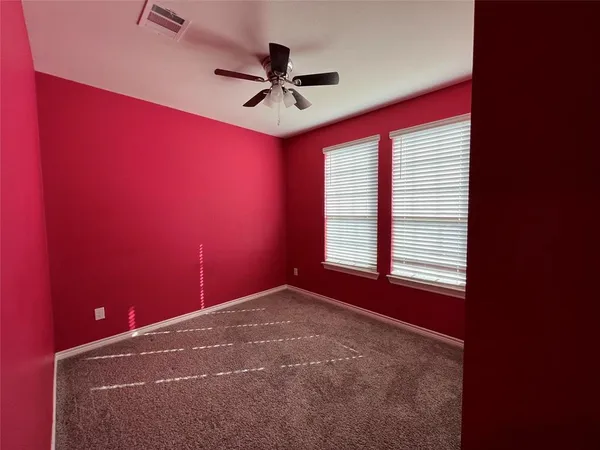 a view of a big room with windows