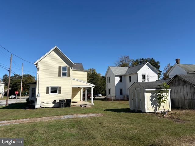 301 Central Avenue Ridgely, MD 21660 - Photo 17 of 20 a view of a white house in front of a big yard with large trees