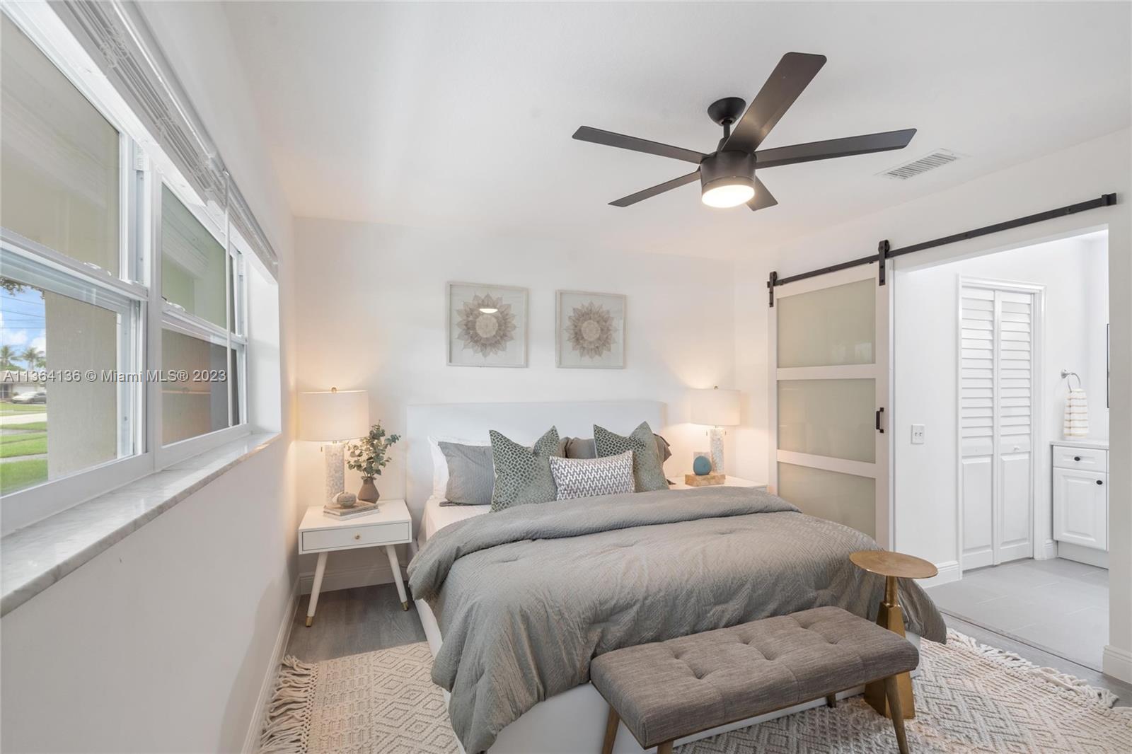 7321 Northwest 11th Place Plantation, FL 33313 - Photo 12 of 23 a bedroom with a bed and a window