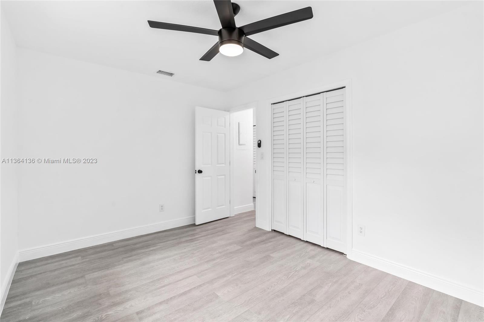 7321 Northwest 11th Place Plantation, FL 33313 - Photo 15 of 23 a view of a room with wooden floor
