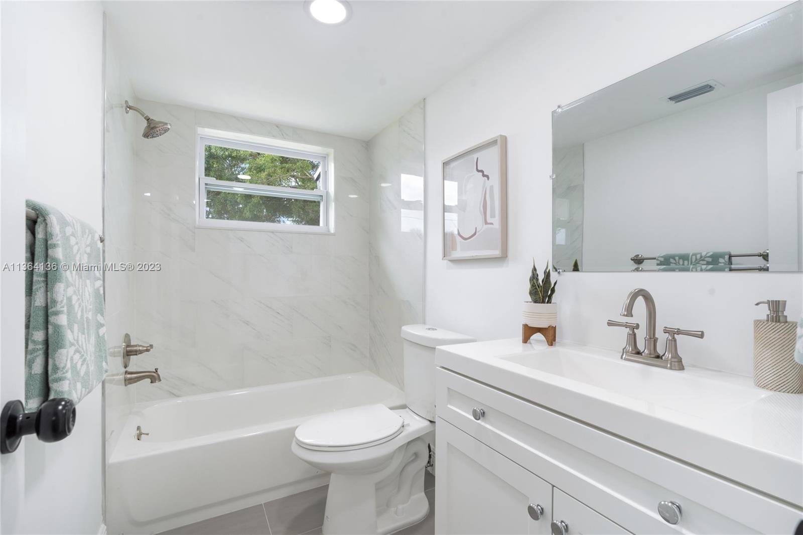 7321 Northwest 11th Place Plantation, FL 33313 - Photo 19 of 23 a bathroom with a sink a toilet and shower