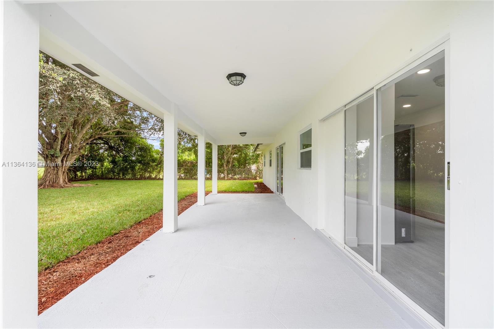 7321 Northwest 11th Place Plantation, FL 33313 - Photo 20 of 23 a view of a porch and garden